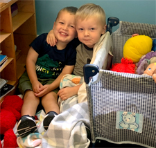 2 boys playing together at Stepping Stones Child Care